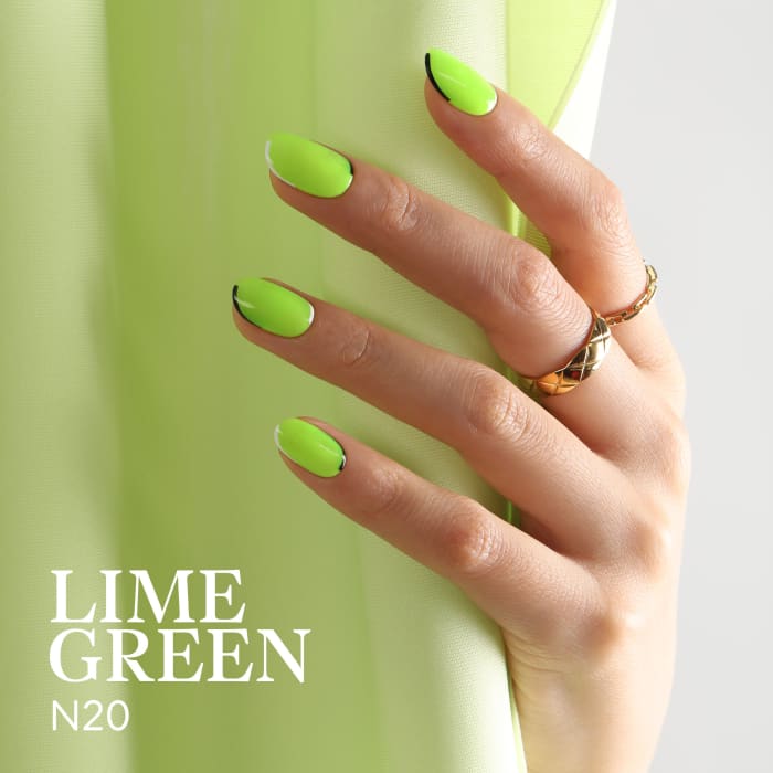 Female neat hand with short natural nails painted with green nail polish.  Natural, cozy, elegant Stock Photo by korabkova